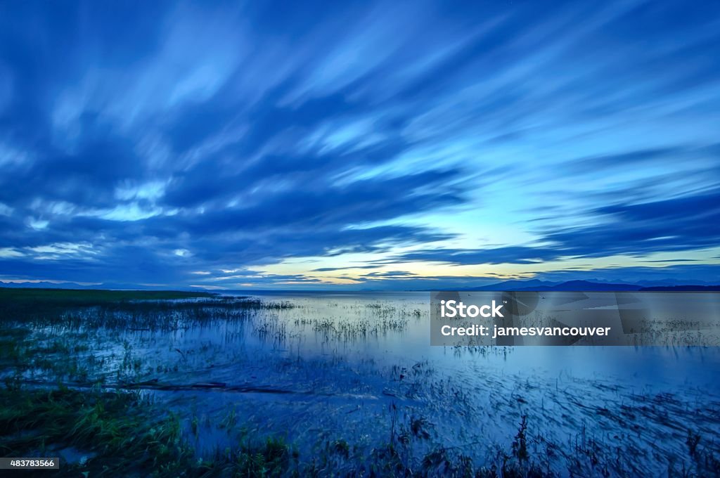 estuary at sunset with dramatic clouds 2015 Stock Photo