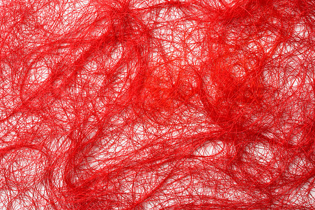 istock Isolated shot of crowded red thread on white background 483784236