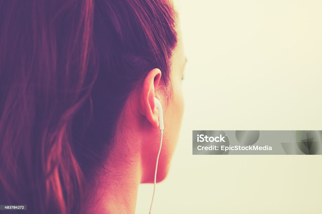 Fitness Woman Listening to Music Active Sports Lifestyle with Modern Technology. Young fitness woman listening to music Exercising Stock Photo