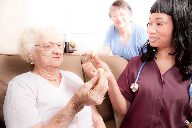 istock Healthcare: Senior woman does finger therapy with putty. 483785279