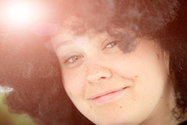 istock Young Woman w afro wig. 483787991