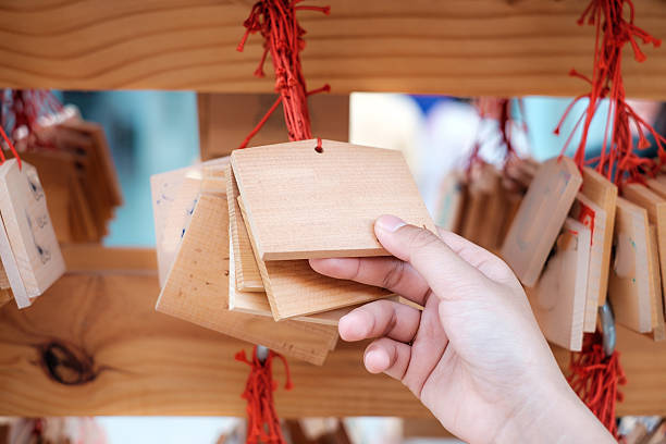 Hand with wooden board for good luck