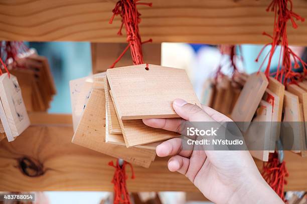 Hand With Wooden Board For Good Luck Stock Photo - Download Image Now - Shrine, Japan, Japanese Culture