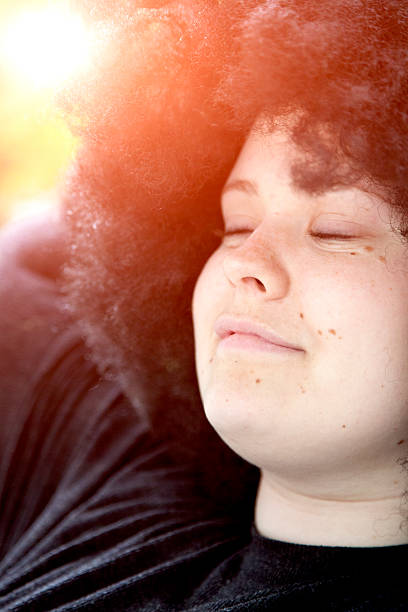 Young Woman w afro wig.