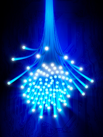 Fiber optic strands emitting light against a circuit background