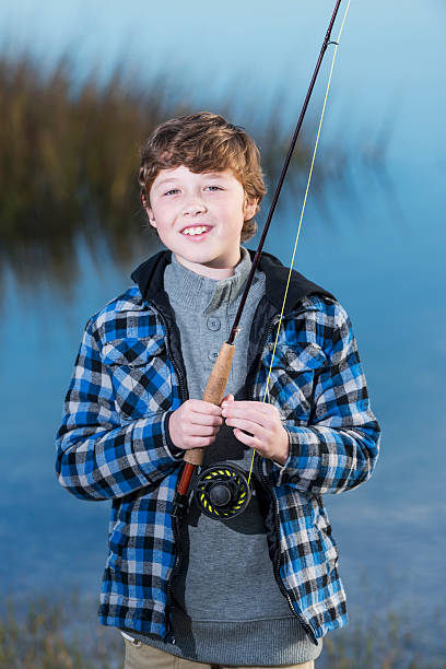 istock Boy with fishing rod 483789801