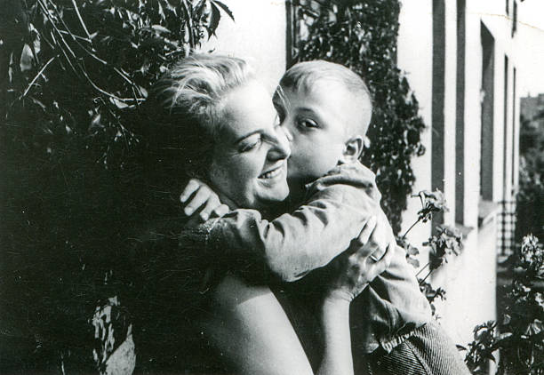 Vintage photo of mother and son on balcony stock photo