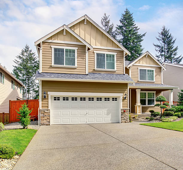 istock Modern northwest home with tan exterior, and garage. 483790460