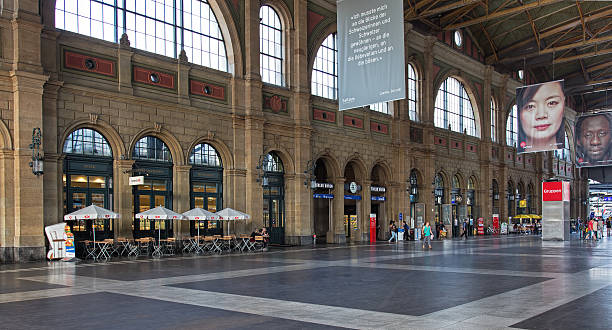 Hall of the Zurich Main Railway Station Zurich, Switzerland - 9 August, 2015: people in the hall of the Zurich Main Railway Station. Zurich Main Railway Station (German: Zurich Hauptbahnhof, often shortened to Zurich HB) is the largest railway station in Switzerland. zurich train station stock pictures, royalty-free photos & images