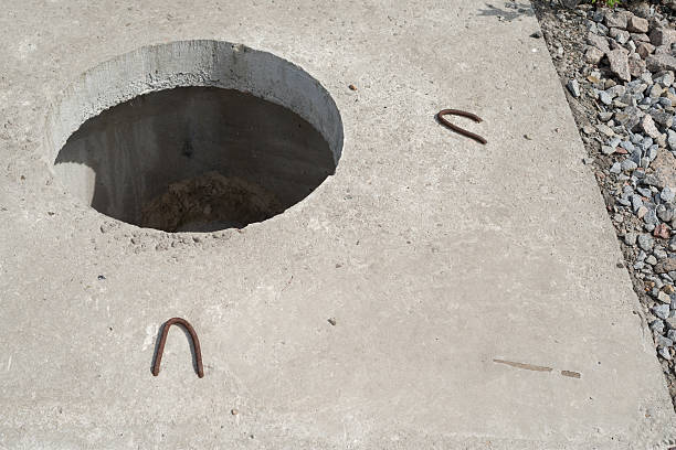 istock Manhole without cover in new concrete block 483790976