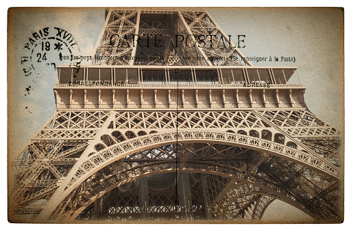 French postcard from Paris with landmark Eiffel Tower. Vintage sentimental retro style paper background