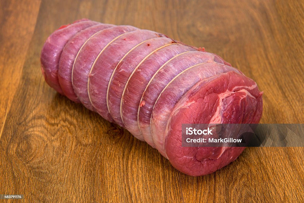 Rolled Brisket of beef joint Brisket of beef joint on a wood background. Brisket Stock Photo