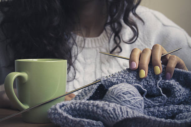 istock The girl, knitting and green cup 483793844