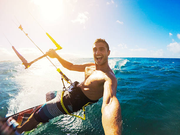 Kiteboarding, Extereme Sport Kiteboarding. Fun in the ocean, Extreme Sport Kitesurfing. POV Angle with Action Camera kiteboarding stock pictures, royalty-free photos & images