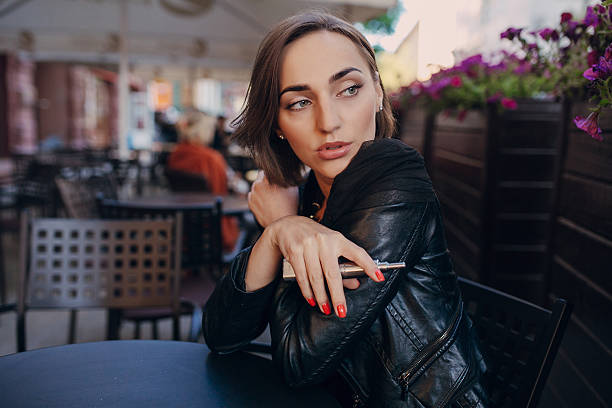 istock beautiful glamorous brunette smoke electronic cigarette 483796592