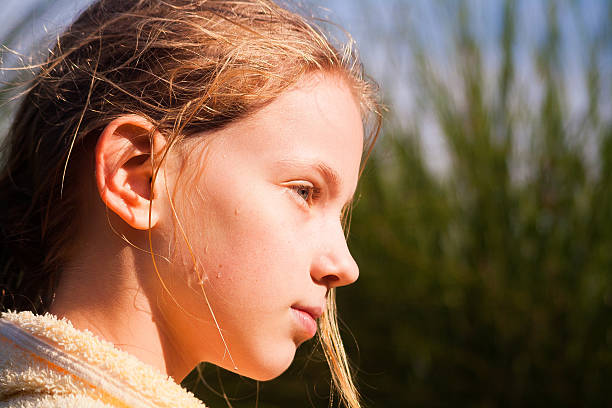 istock Girl daydreaming at golden hour 483797672