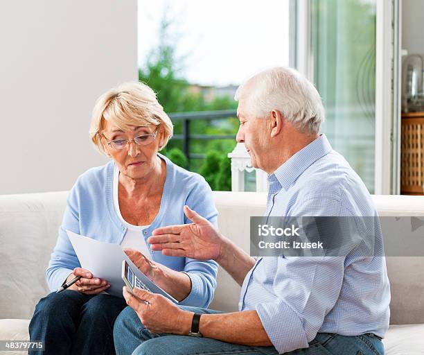 Home Finances Stock Photo - Download Image Now - 60-69 Years, 70-79 Years, Adult