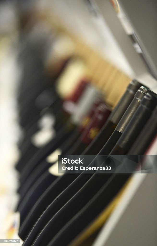 Assortment of Wines on Wine Rack - Shallow Focus Wine Bottle Stock Photo