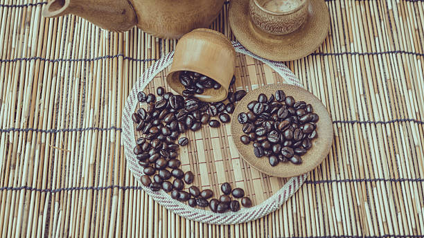 istock Coffee beans on bamboo wooden background. 483798746