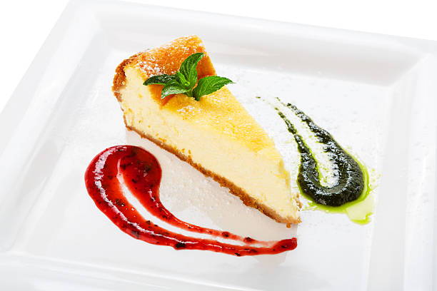 istock Restaurant dessert - cheesecake with mint and berry sauces 483799070