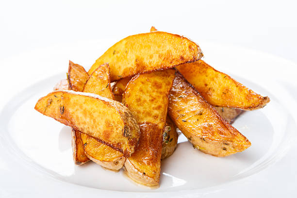 istock Crispy baked potato wedges closeup 483799082