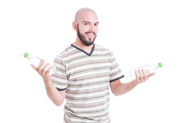 istock Smiling man holding two bottles of water 483799108