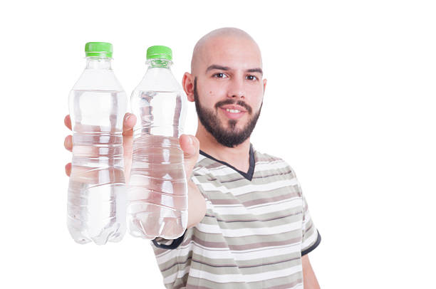 istock Happy man holding two bottles of cold water 483799116