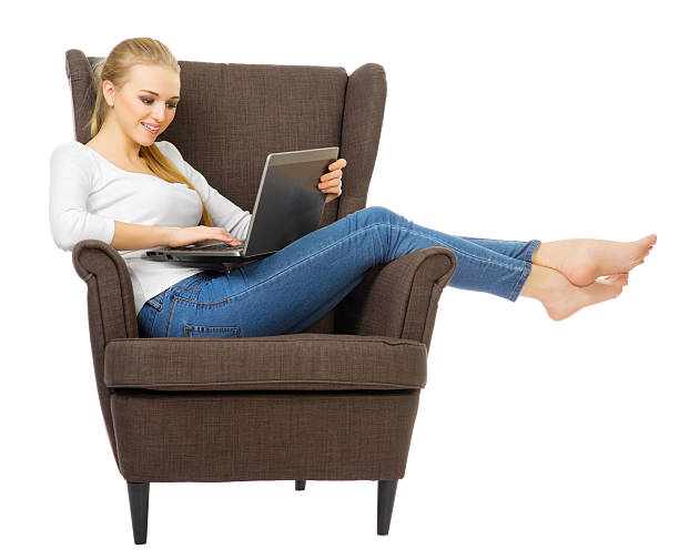 istock Young girl with laptop sit on chair 483799251