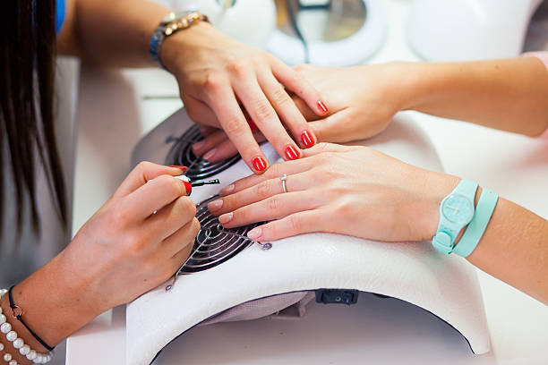 Woman hand on manicure treatment in beauty salon. Beauty parlour. stock photo