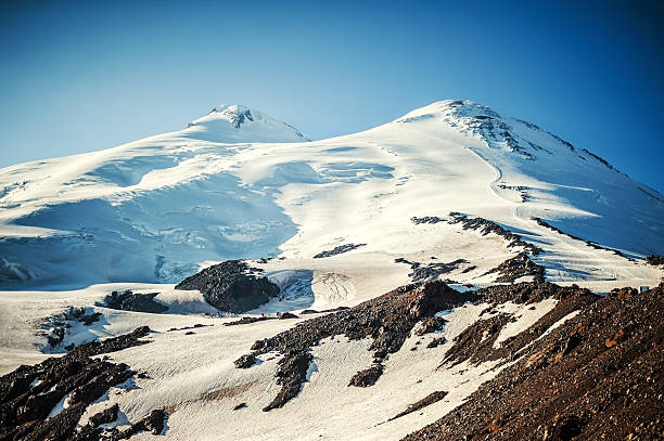 The western and eastern peaks of Elbrus closeup stock photo