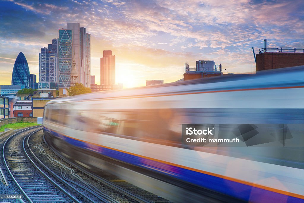 London Overground with skyscrapers in the background London Overground with the City of London skyscrapers in the background (including The Gerkhin) Train - Vehicle Stock Photo
