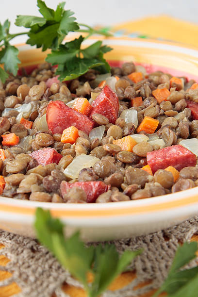 istock Lentil stewed with smoked sausage, onions 483801545