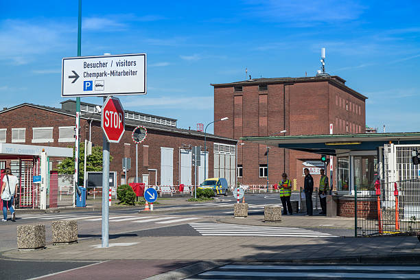 Plant security arriving at Chempark Uerdingen Krefeld, Germany - August 5, 2015: Krefeld, Germany - August 5, 2015: Plant security arriving at Chempark Uerdingen short after the explosion of a azote tank  bayer schering pharma ag photos stock pictures, royalty-free photos & images