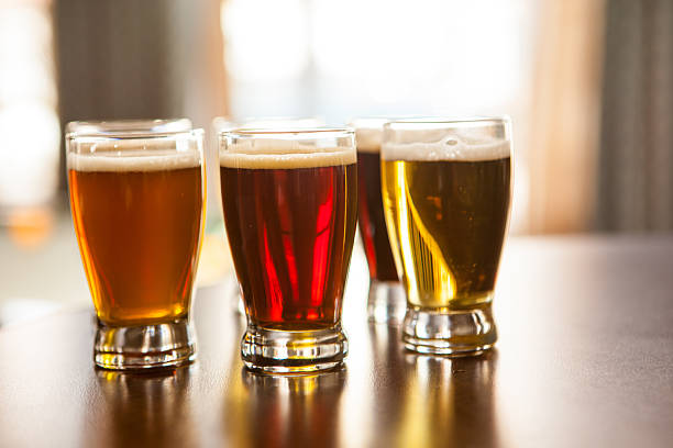 istock Glasses of sample beers on a bar. 483802740