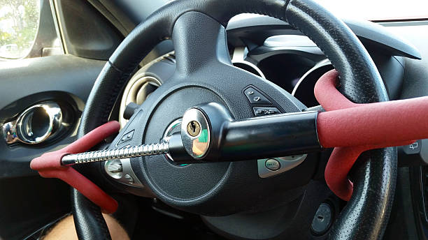anti-theft auto steering wheel lock - lock up foto e immagini stock