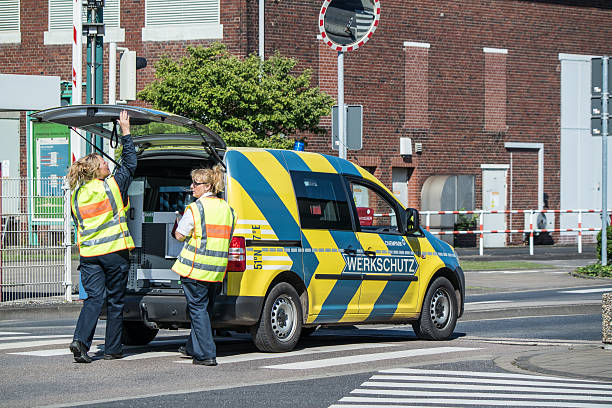 Plant security arriving at Chempark Uerdingen Krefeld, Germany - August 5, 2015: Krefeld, Germany - August 5, 2015: Plant security arriving at Chempark Uerdingen short after the explosion of a azote tank  bayer schering pharma ag photos stock pictures, royalty-free photos & images