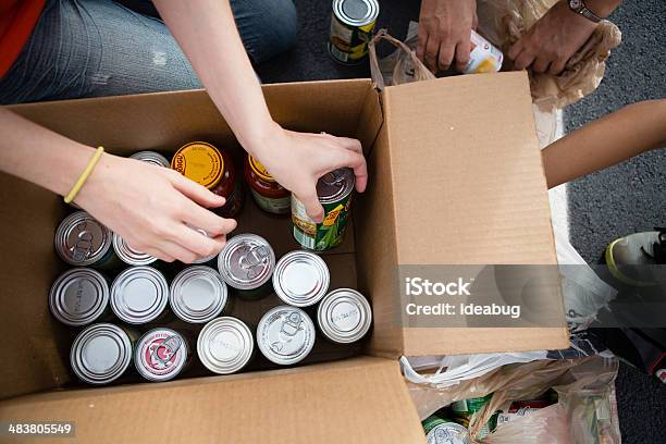 Volunteers Boxing Cans At Food Drive Stock Photo - Download Image Now - Food Drive, Canned Food, Food