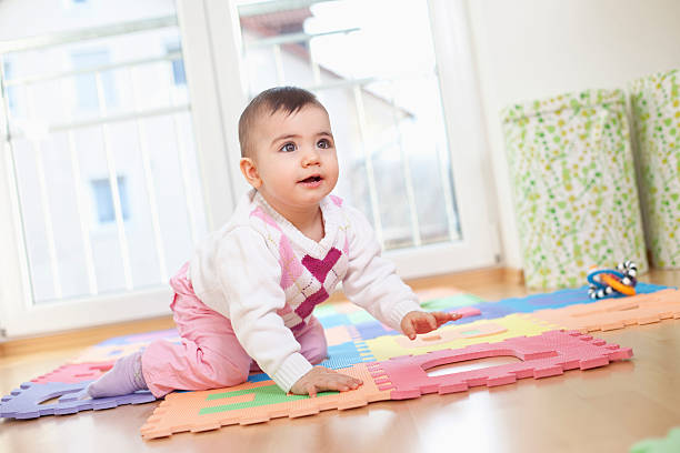 istock Bavaria,Baby girl crouching on puzzle 483806924