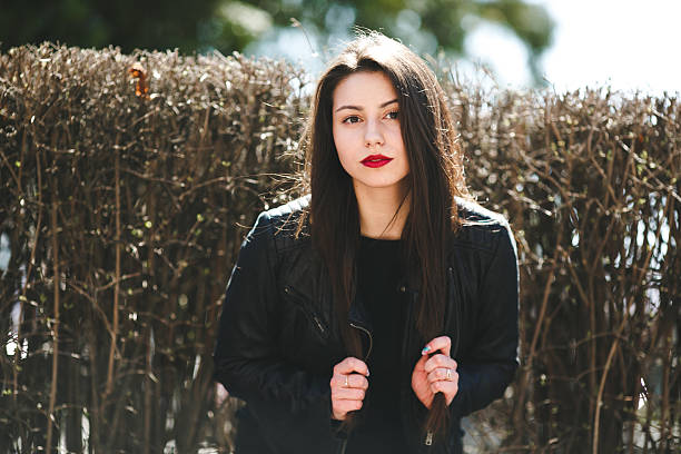 istock Glamorous young woman in black leather jacket 483809042