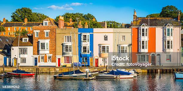 Colorful Homes Quaint Cottages In Sunny Fishing Village Harbor Panorama Stock Photo - Download Image Now
