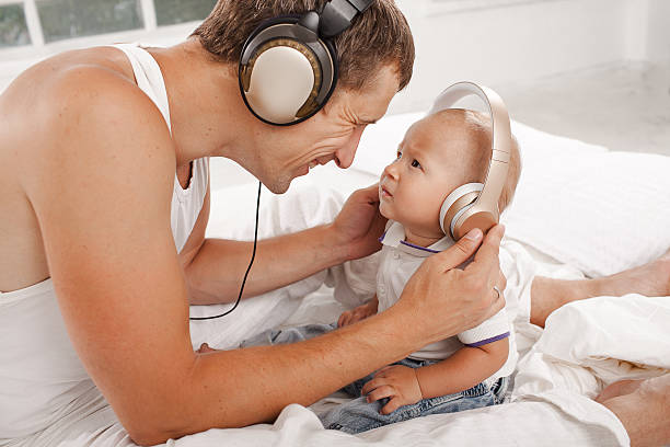 istock young father with his nine months old som on the 483809486