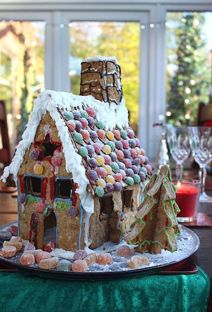 Image of gingerbread house on Christmas table runner with sweets