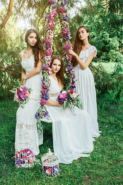istock Beautiful young girls on a swing 483812244
