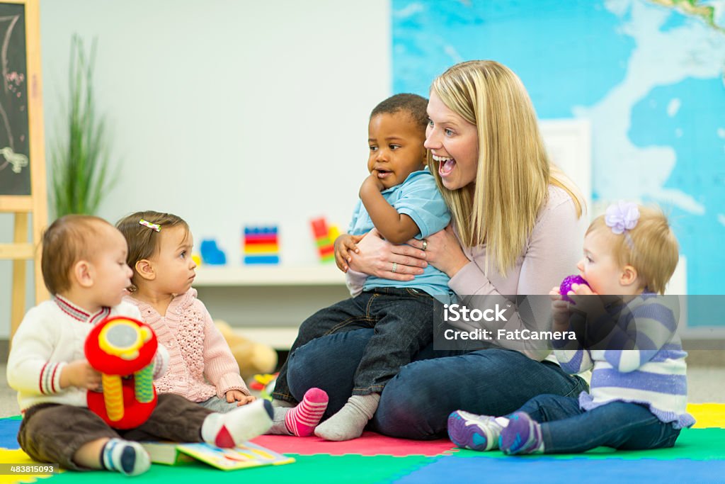 Daycare Group of babies in daycare. 12-17 Months Stock Photo