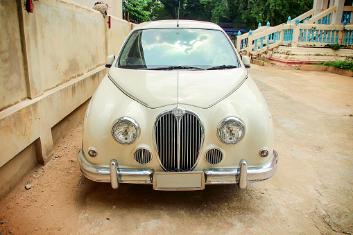 Phranakornsri Ayutthaya, Thailand - August 8, 2015: The classic car, Mitsuoka Viewt, is parking in Wat Klang Klong Sra Bua, Phranakornsri Ayutthaya, Thailand where is toursism temple.