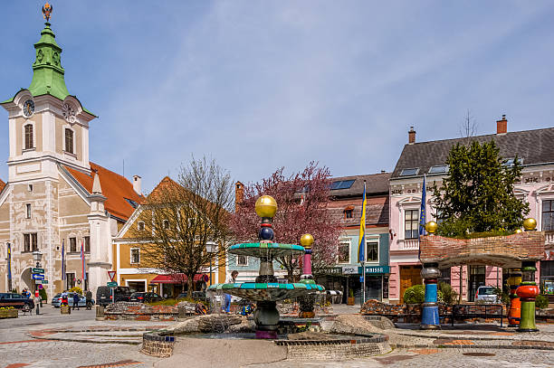 The Hundertwasser fountain and town hall of Zwettl, Lower Austria Zwettl, Austria - April 25, 2015: The Hundertwasser fountain in front of old town hall and colorful houses in town Zwettl - a district capital of the Austrian state of Lower Austria. It was built in 1994 and is located right in the middle of the main square. hundertwasser haus in vienna austria stock pictures, royalty-free photos & images