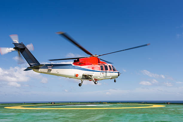 istock Helicopter taking off from jack up oil rig helipad 483817903
