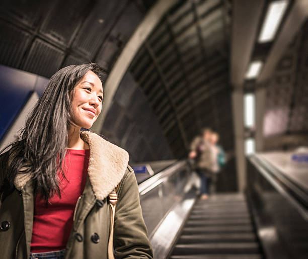istock Chinese Woman on the escalators 483818287