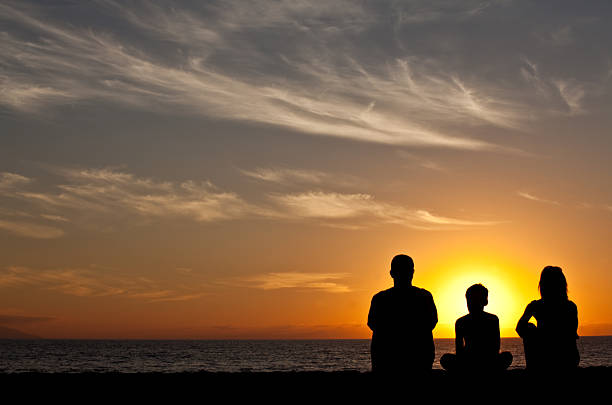 istock Young Family on the Beach at Sunset 483819691