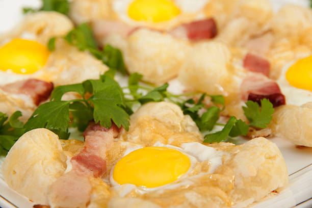 istock   Sandwich with quail egg and ham on the puff pastry. 483820323